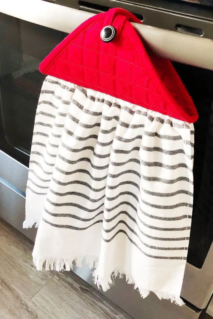 A dish towel hanging on a oven handle