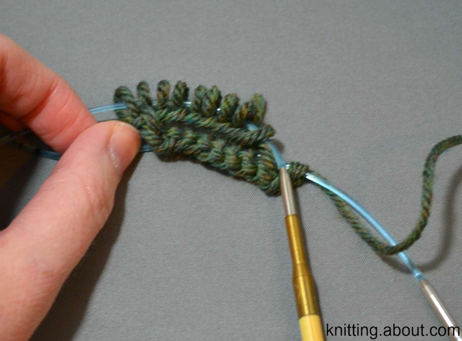 Stitches divided for knitting in the round with two circulars.