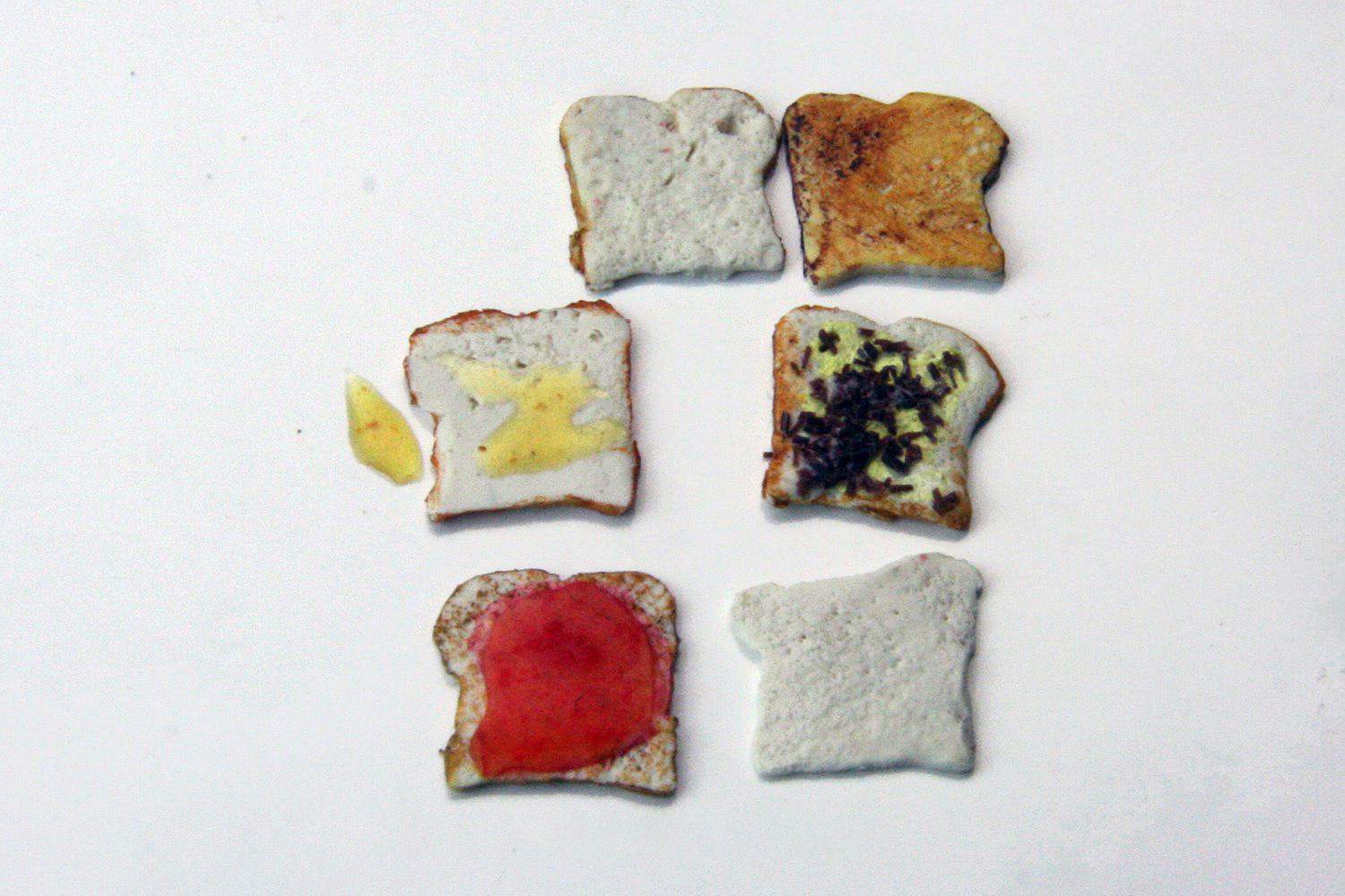 Different bread slices with toppings in doll size