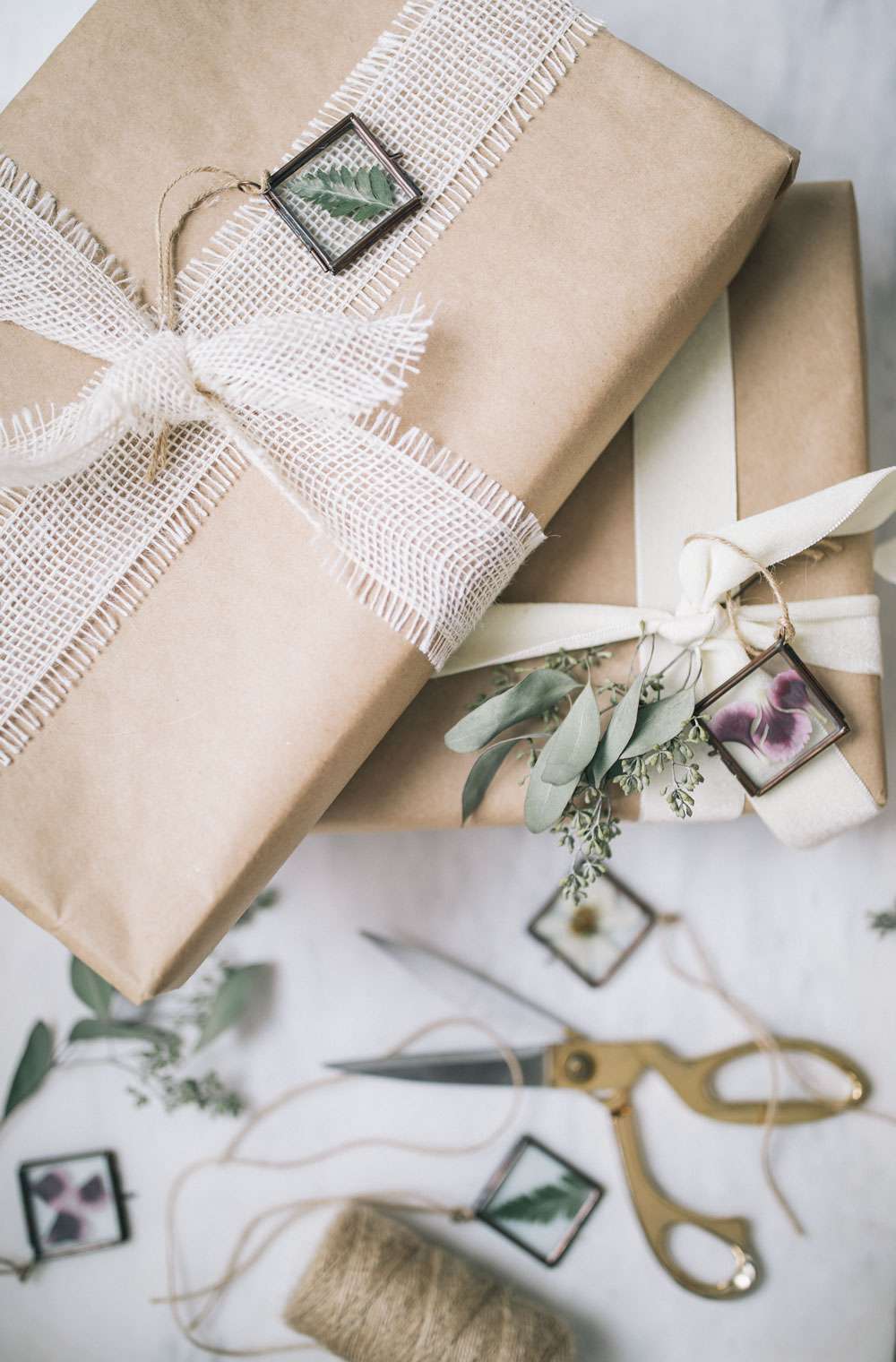 A stack of gifts with pressed flower tags