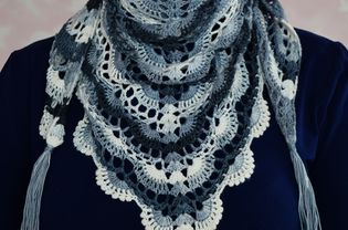 Woman in lace crochet. Woman with colorful shawl. Knitted white-blue handkerchief for girl.