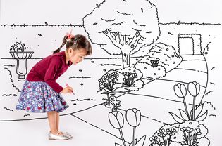 Little girl drawing a park on white background