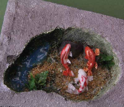 有色腈纶焦油凝胶介质用于创建深度的幻觉在娃娃家规模池。