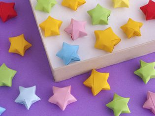 Origami lucky stars spread out over surface