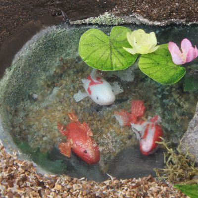 Scale 'fish food' on the water surface makes this simple dollhouse pond extremely realistic.