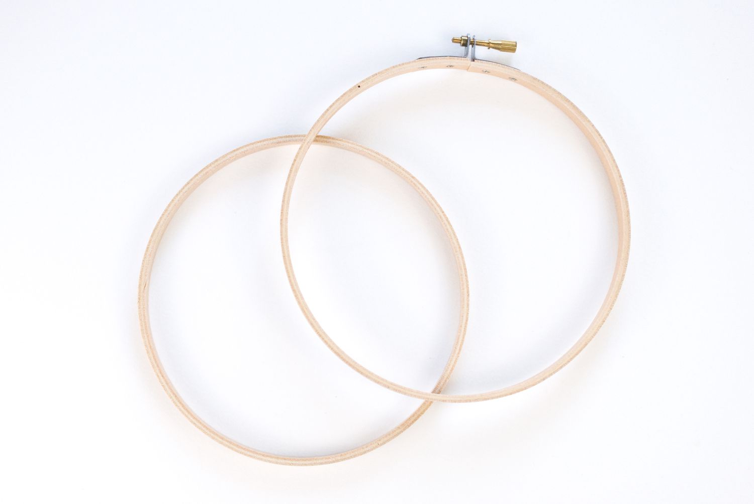 An embroidery hoop taken apart so there are two circles.