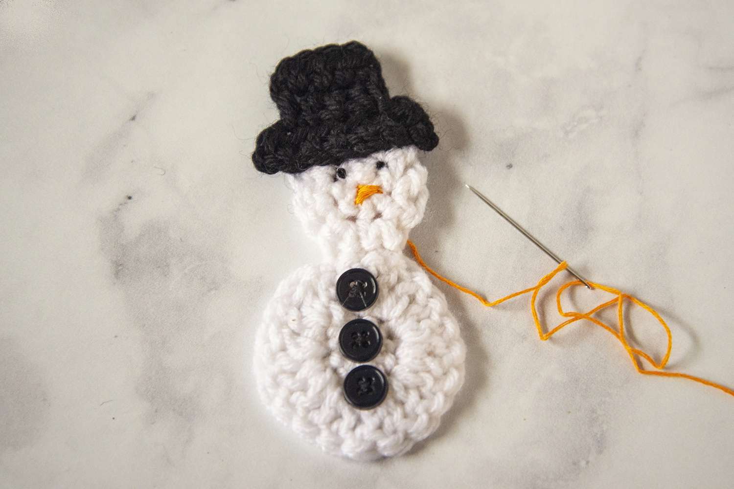 A crocheted snowman.