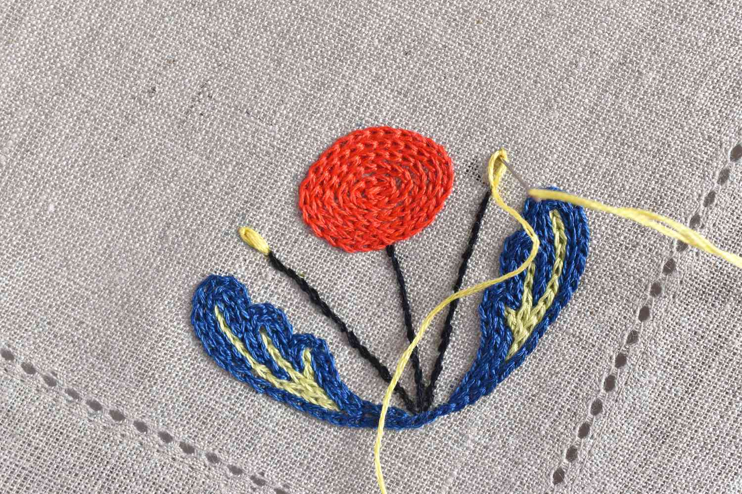 Embroidering a Scandinavian flower