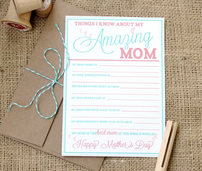 A blue and pink Mother's Day card on a table