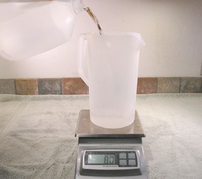 Weighing water on a scale in a pitcher