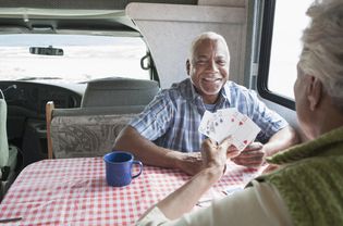 Two men playing cards at a table