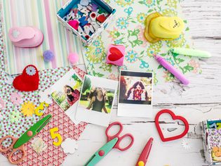 'Assortment of scrapbooking tools including colored paper, pens, and scissors.Click below for more of my scrapbooking and arts and crafts images: