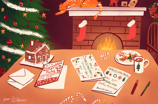 Illustration of free Christmas card printables sitting on a table next to a fireplace and Christmas tree