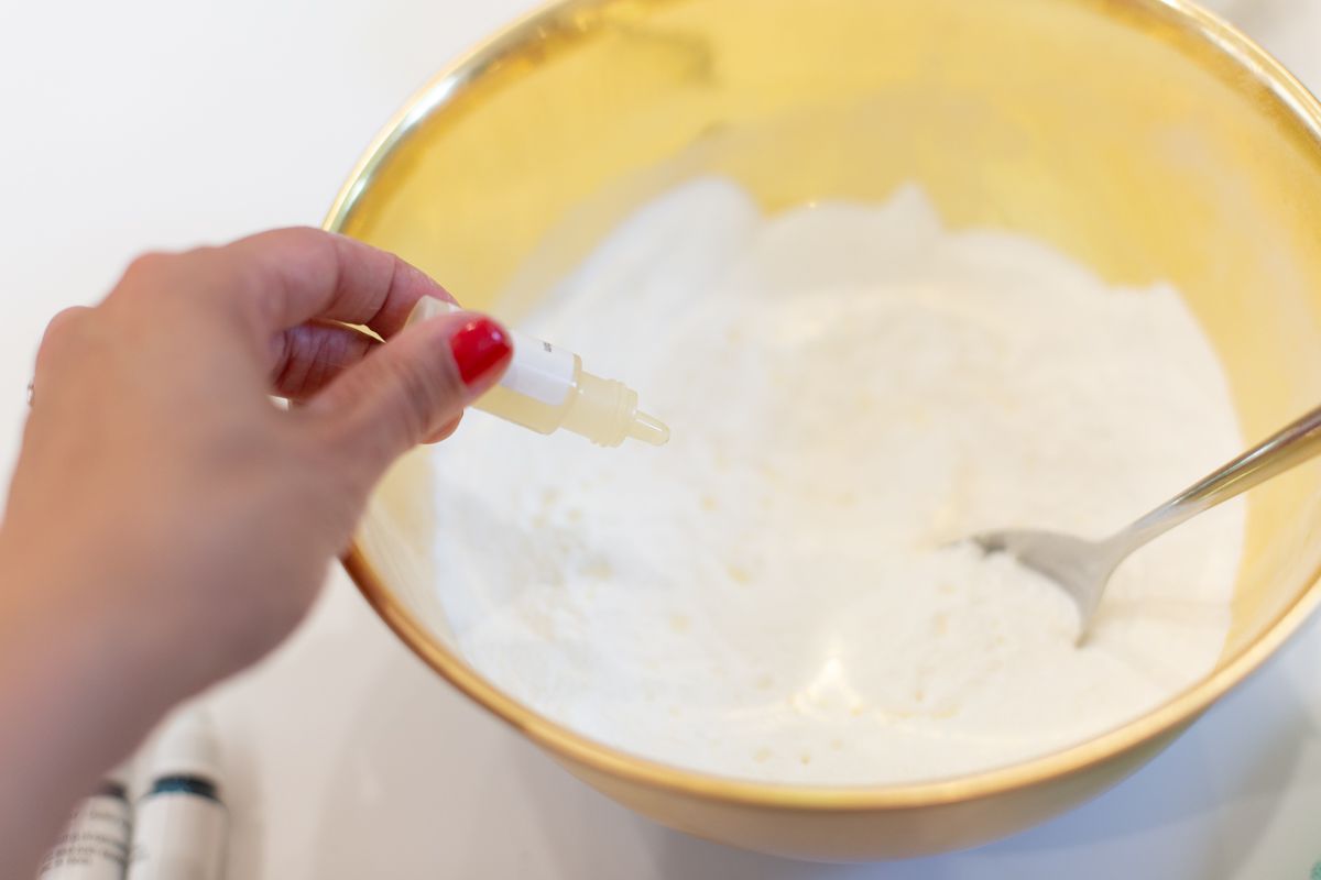 Adding Oil to Dry Ingredients to Create Homemade Fizzy Bath Bombs