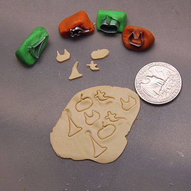 Polymer clay is cut using doll scale cookie cutter