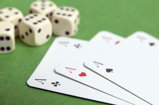 Dice and three aces, close-up