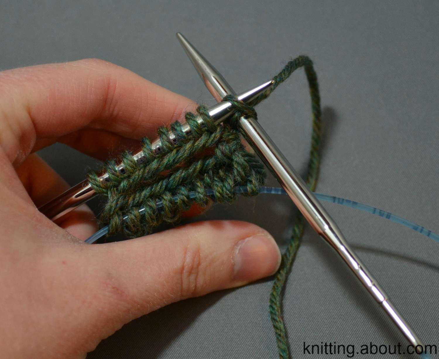 Working on the second needle when knitting in the round on two circulars.