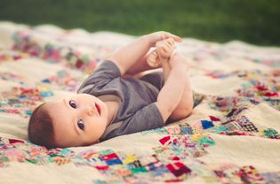 Baby Boy On Vintage Quilt