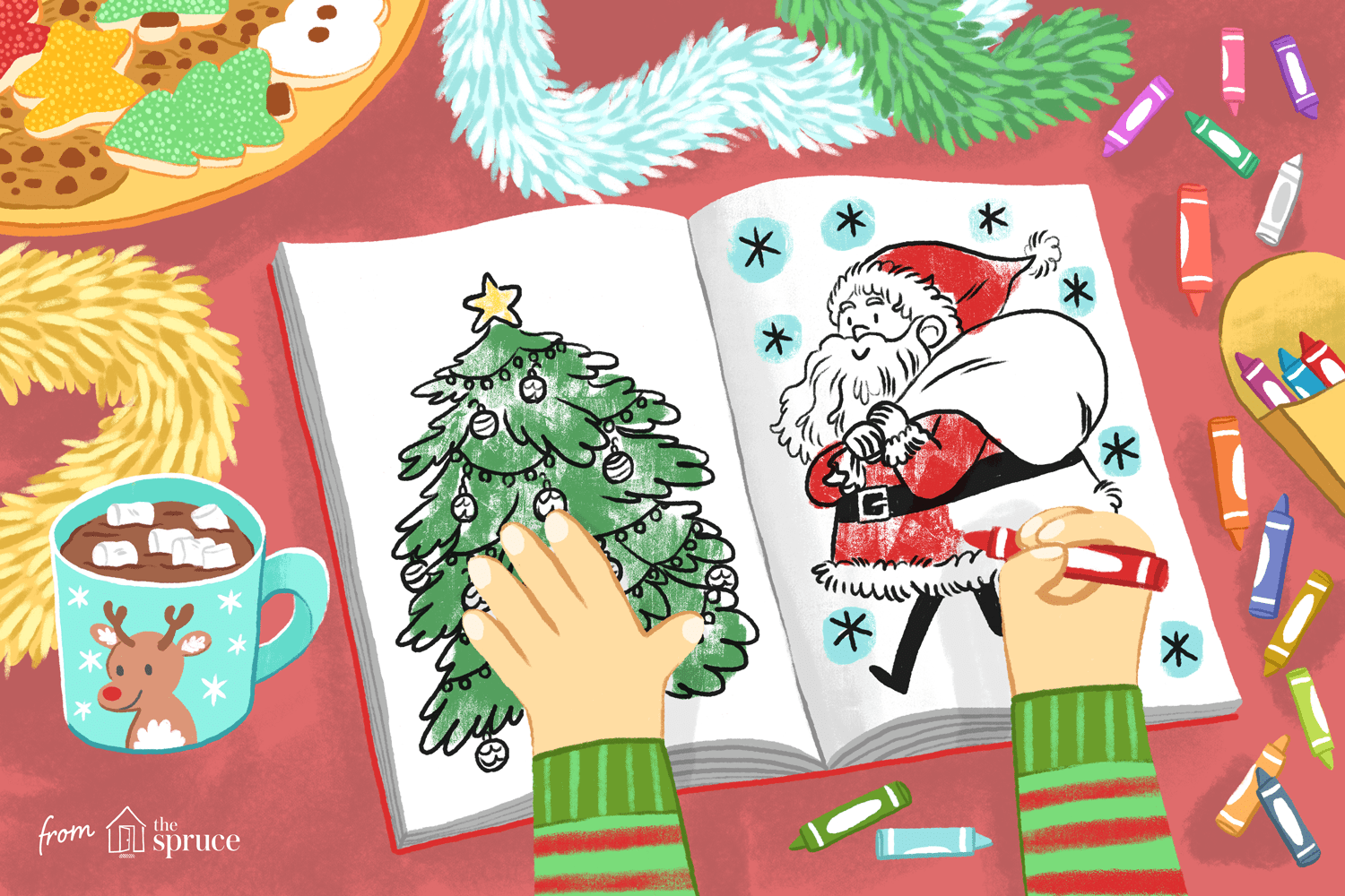 说明孩子的手着色两个圣诞节着色页面在桌子上用蜡笔和可可和节日饼干