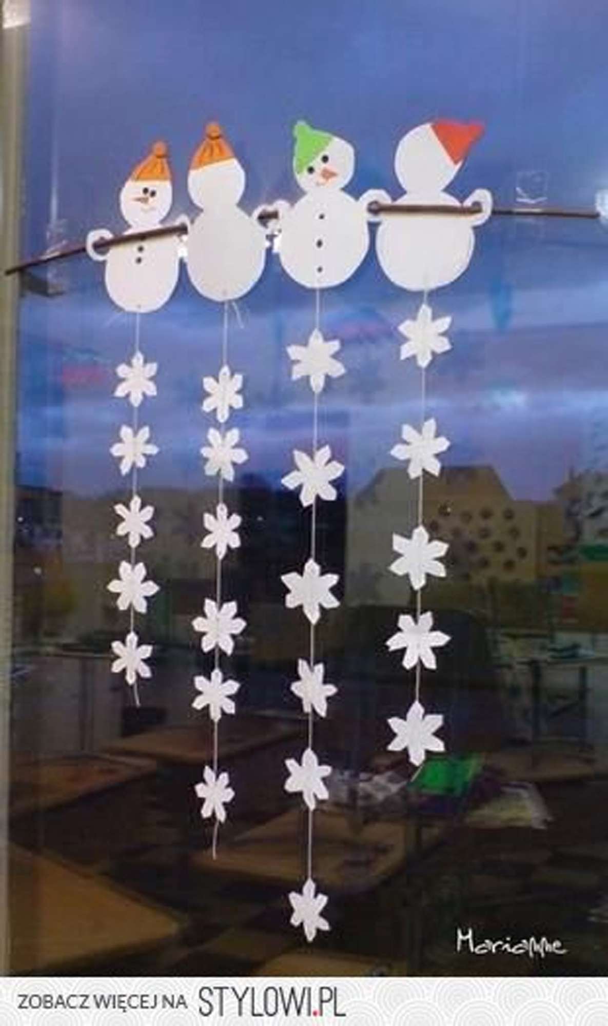 paper snowmen with a string of paper snowflakes
