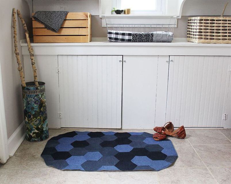 A denim rug with a pair of shoes