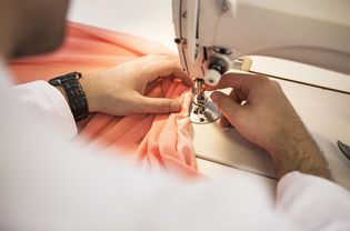 Dressmaker using sewing machine