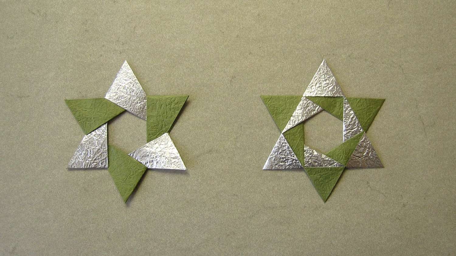Origami hexagon stars in olive green and silver.