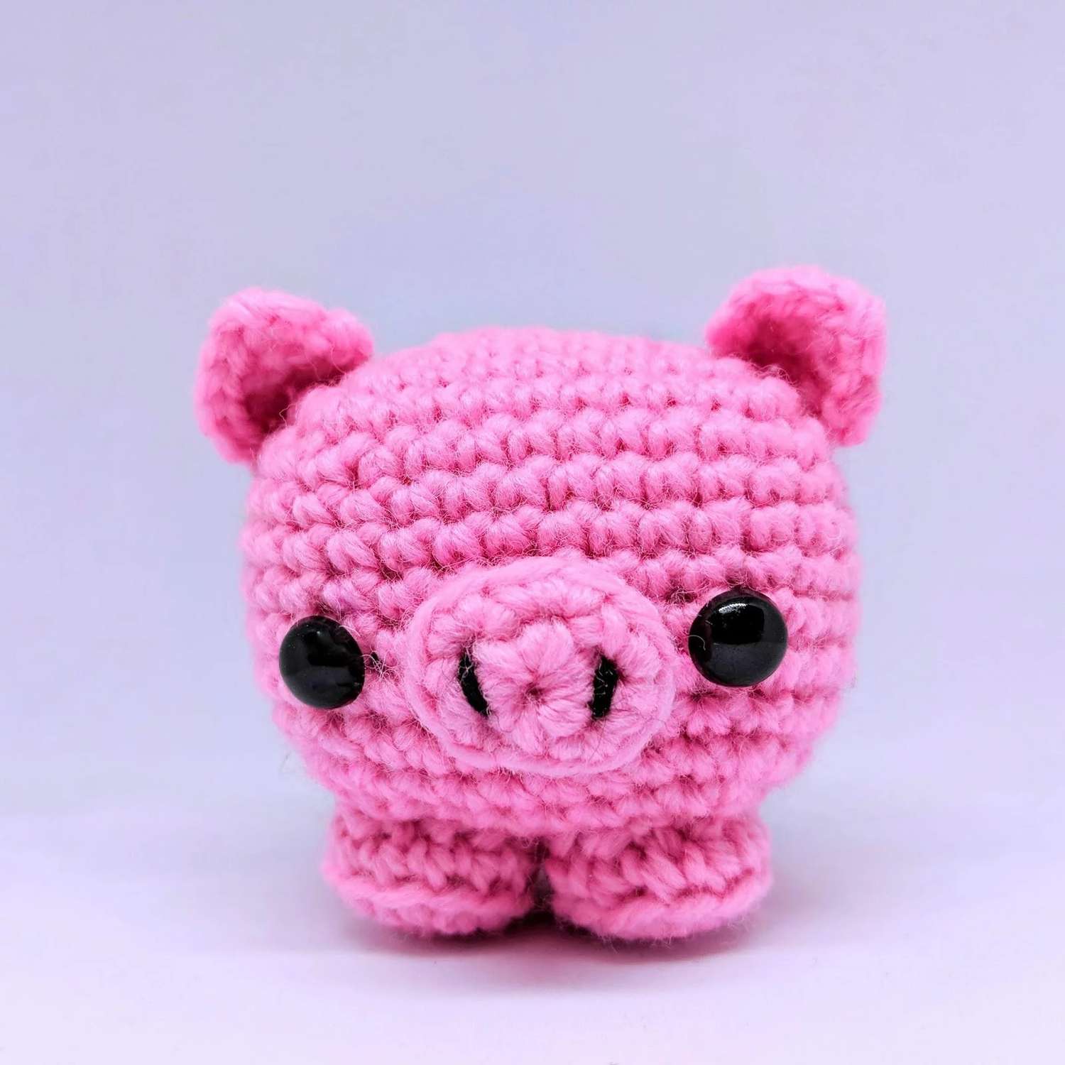 粉红色的钩针猪白色背景。