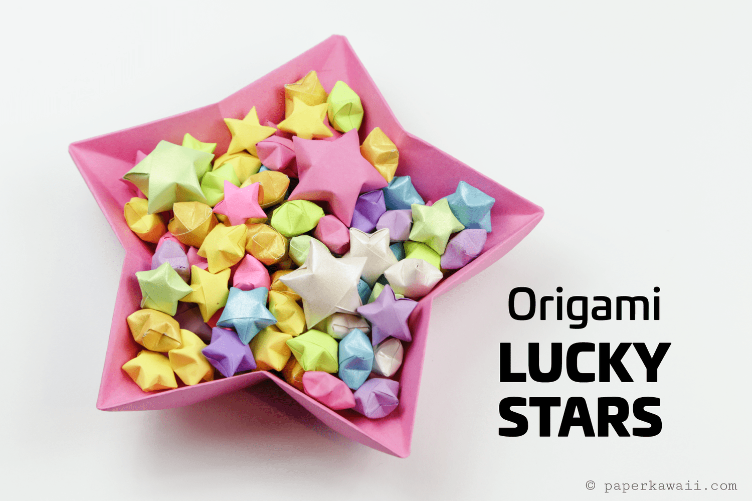 Origami lucky stars bowl with several dozen origami stars inside.