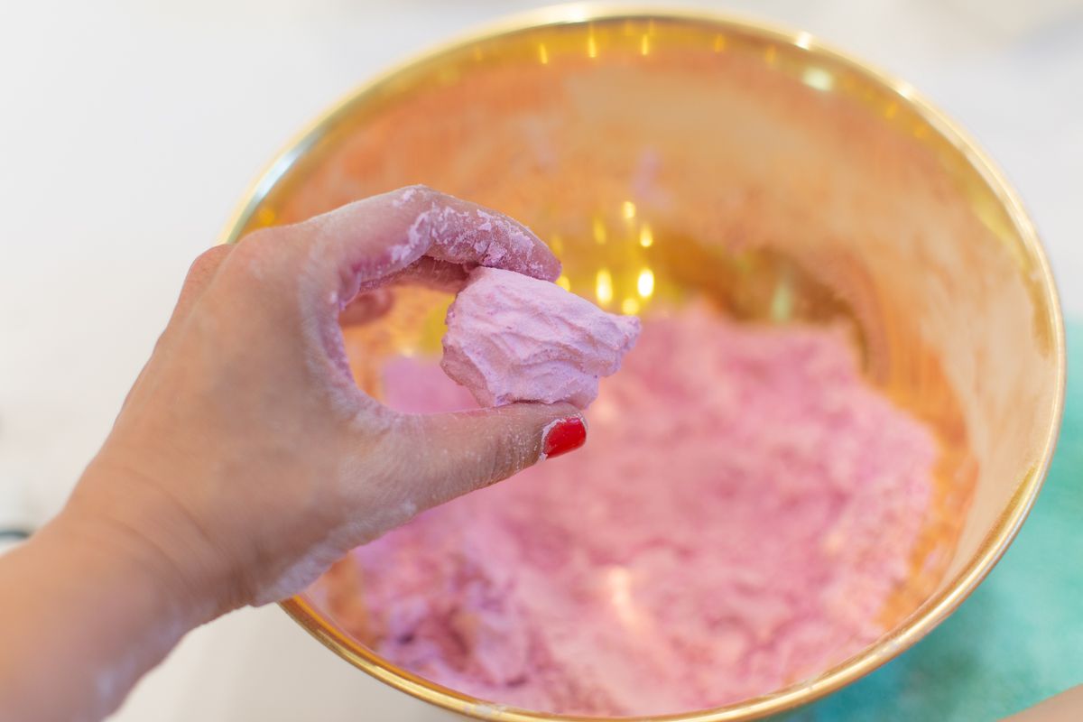 Adding Water to Create Homemade Fizzy Bath Bombs