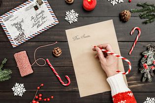 A woman writing to Santa