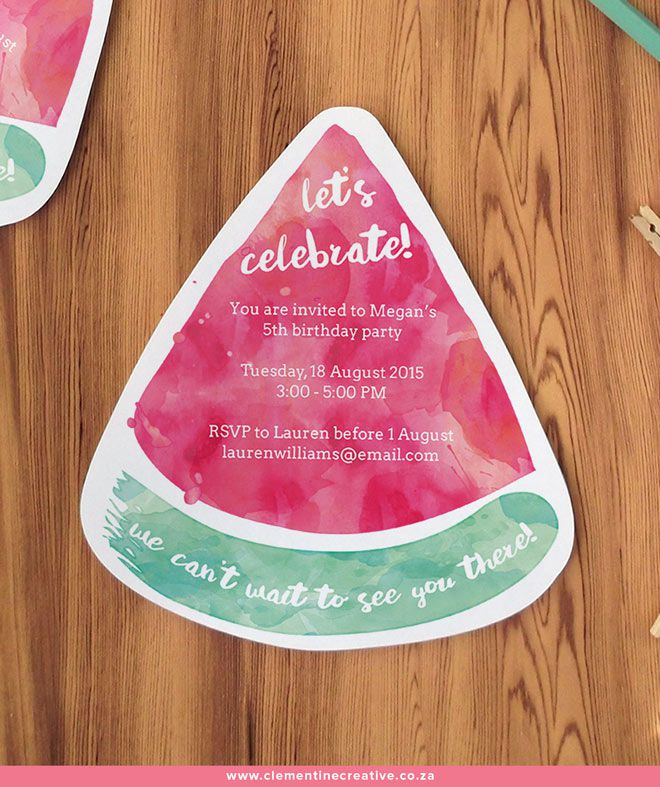 A watermelon birthday invite on a wooden table