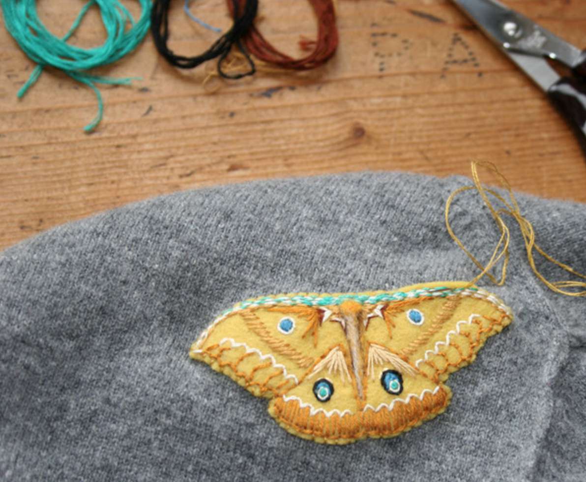 Mending moth holes with embroidered moths