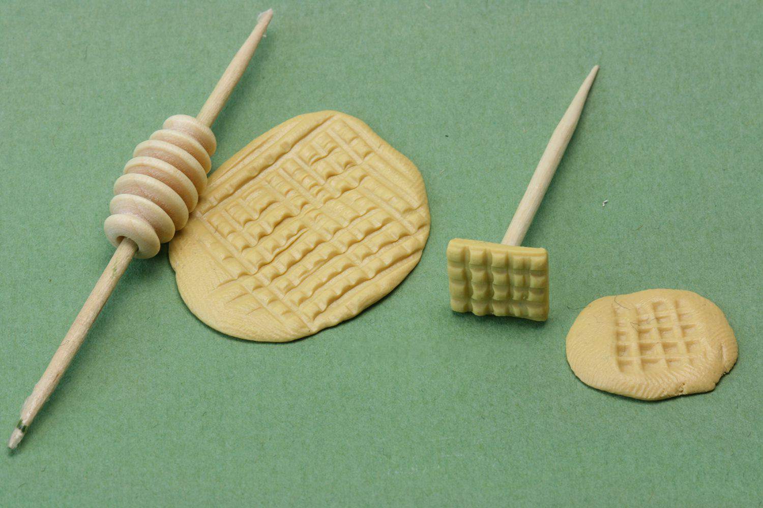 Ridged bead with a toothpick through the centre acts as a miniature rolling pin