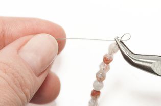 Stringing beads on beading wire