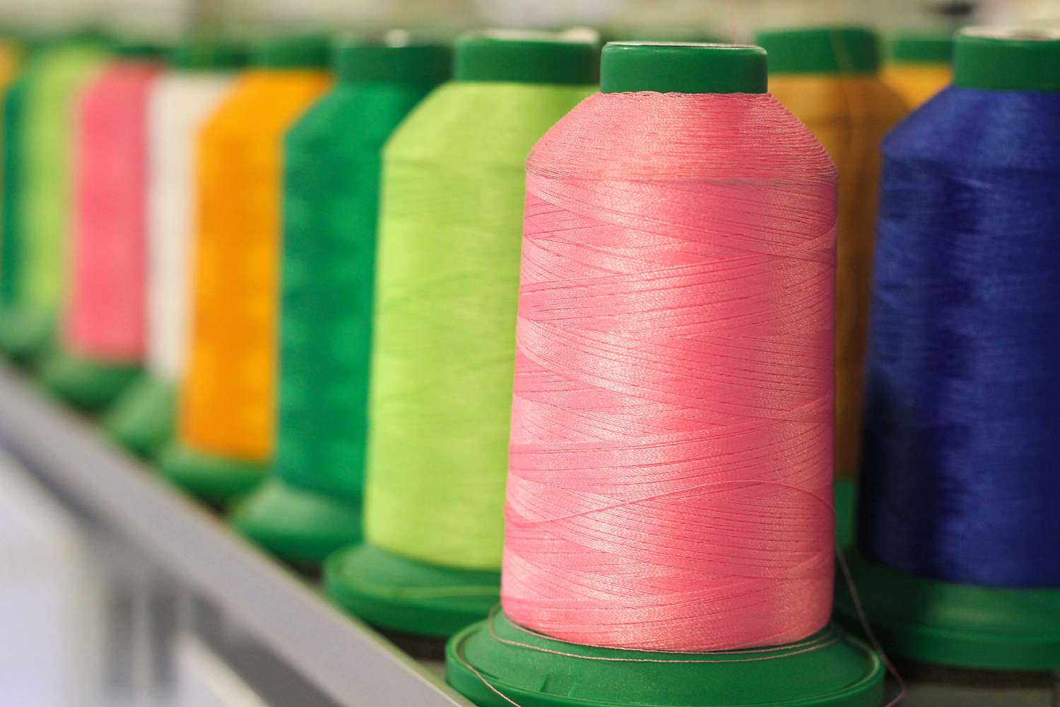 Rows of colorful thread spools