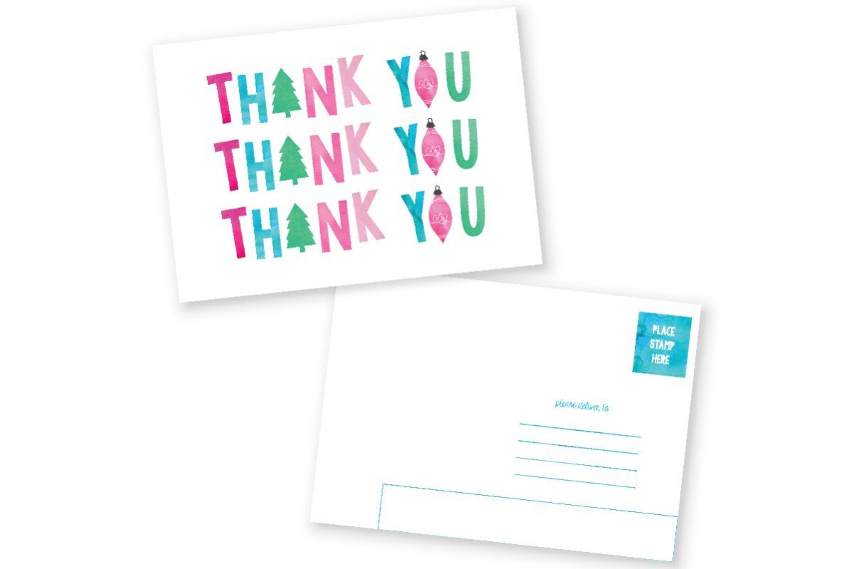 一张用粉色、蓝色和绿色写着“谢谢”的明信片