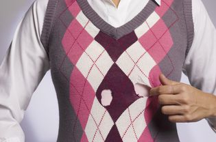 Man wearing sweater with holes