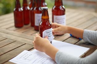 Woman making beer labels