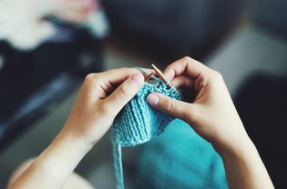 Person knitting a pattern.