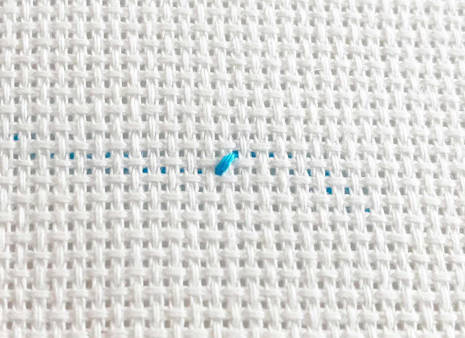 A diagonal made with blue thread