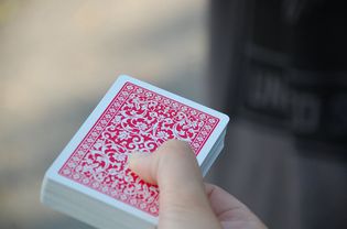 hand holding deck of cards