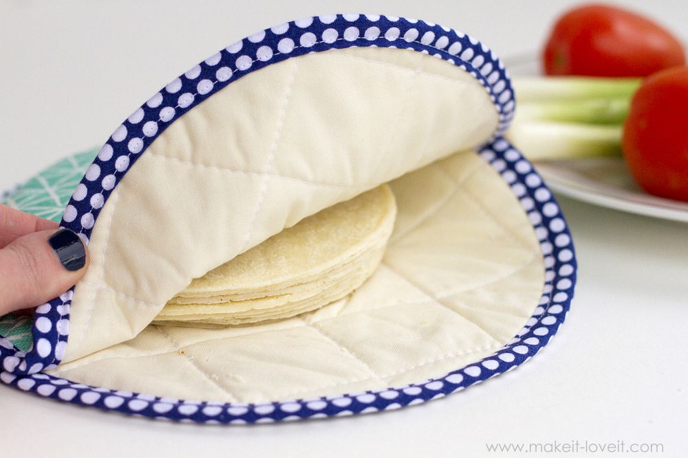 A fabric tortilla warmer with tortillas inside