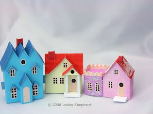 Three Putz style printable miniature cottages in N scale for a Christmas village display.