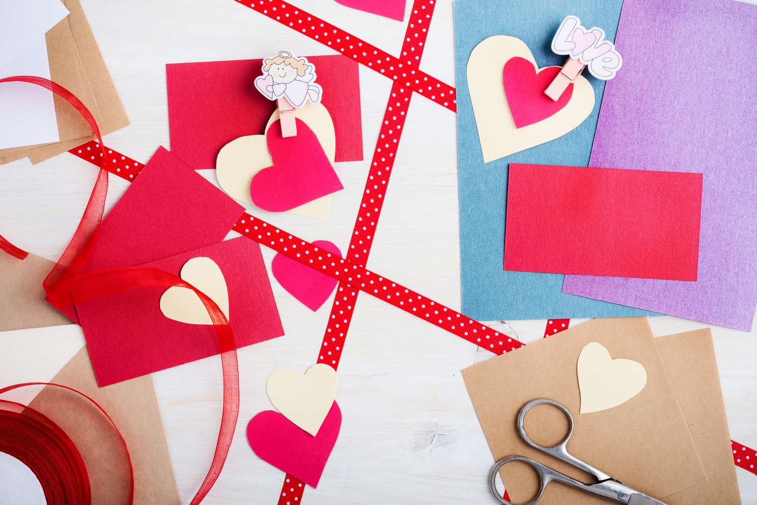 An overhead shot of Valentine's Day paper crafts
