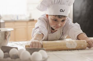 boy baking in chef's hat