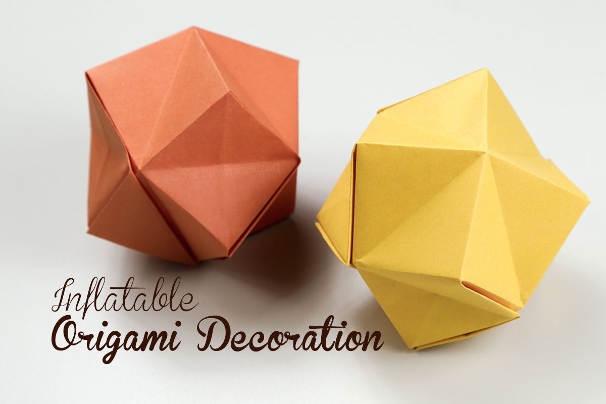 Inflatable origami stars in orange and yellow.